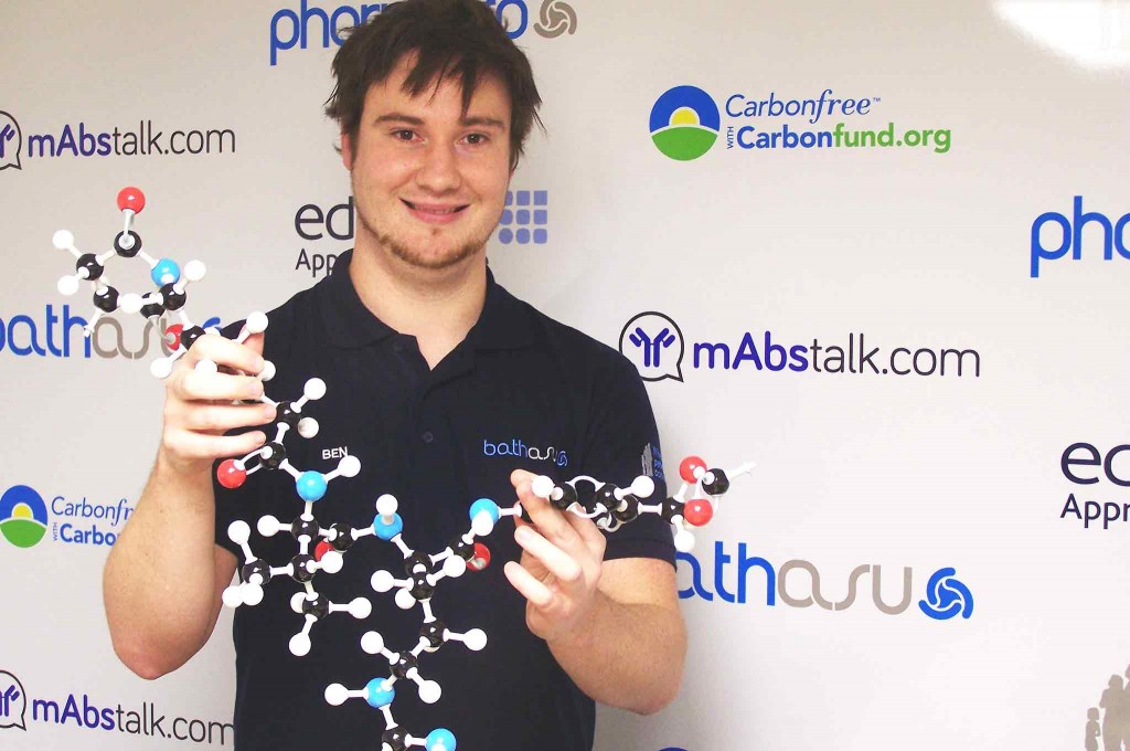 Photo of Ben Young holding model of a molecule